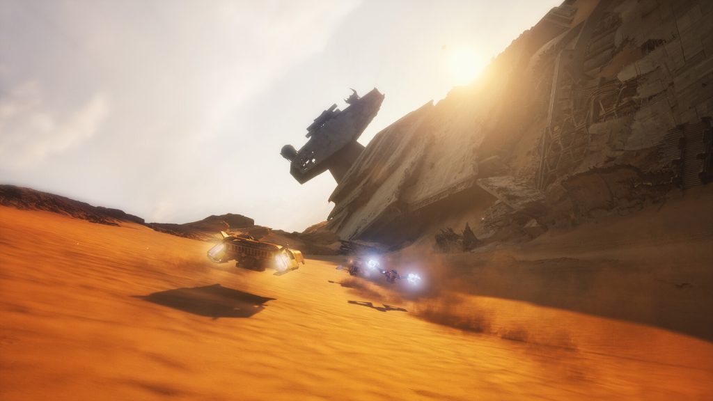 Racers speeding across desert dunes past a crashed Star Destroyer in Star Wars: Galactic Racer