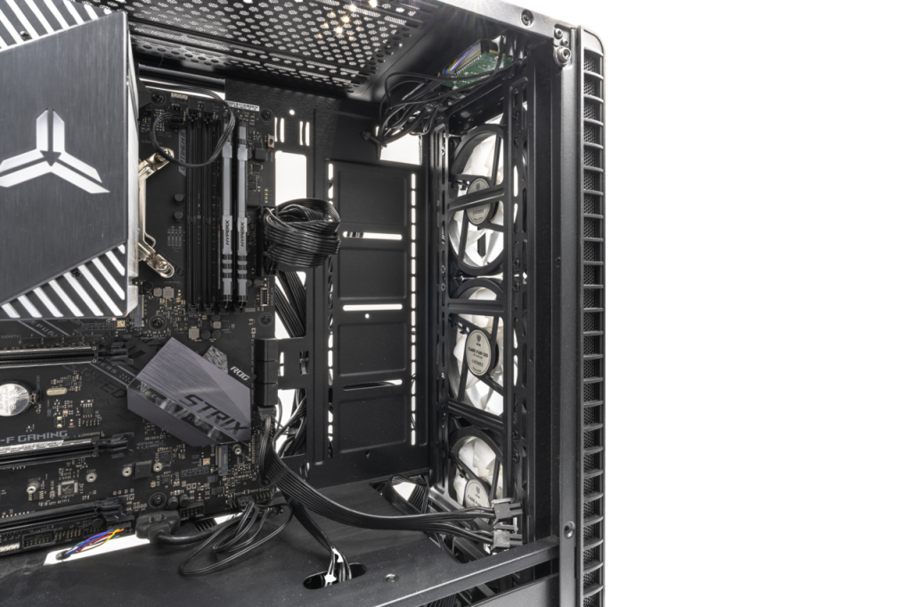 A gaming PC with its side panel off, showing the graphics card, cooler and memory