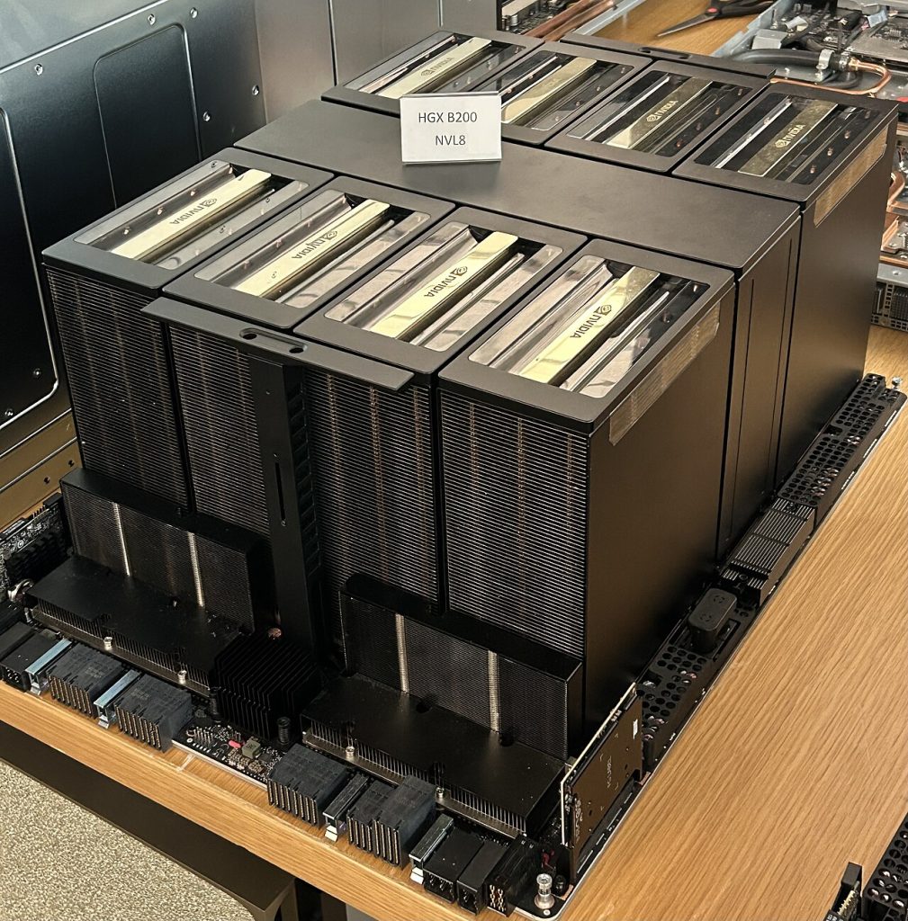 An Nvidia HGX B200 board with eight GPU heatsinks on display