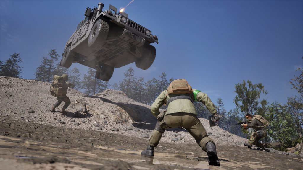 A Humvee flying over a ridge above Wardogs soldiers