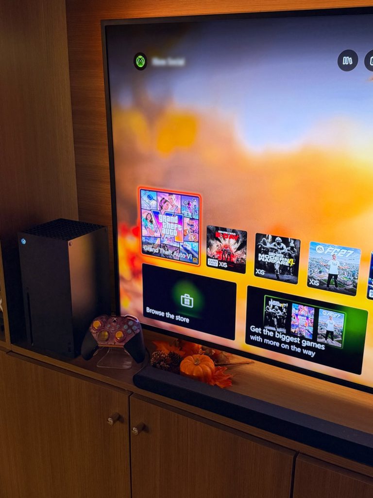 Xbox Series X dashboard showing a Grand Theft Auto VI tile, next to a pumpkin, a pinecone and a translucent Xbox Elite controller
